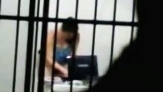 sexy brunette masterbates in a cell behind bars while on her laptop porn