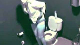 Blonde in high heels and lingerie rubs pussy in toilet voyeur