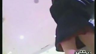 Sweet brunette shows her ass in upskirt voyeur video