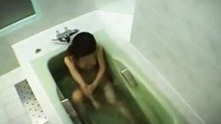 Naked Asian babe washing her hairy pussy and perky small boobs before masturbating