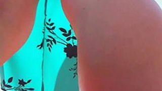 Smooth legs with a sexy tattoo in this street upskirt video
