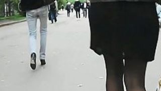 A hottie in black dominates this street upskirt video