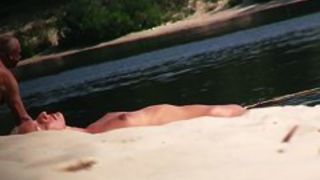 Hot nude blonde sunbathing filmed by hidden beach camera