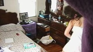 Voyeur cam of a teenager in her room after a shower
