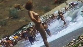 Real beach voyeur video of hot nudist chicks showing off their bodies by the water
