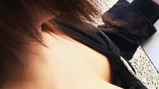 Downblouse of an Asian chick with pleasant breasts in a black jacket