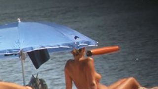Voyeur webcam catches amateurs nude and half nude on beach