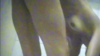 Girl showering body and dressing on spy cam in dressing room