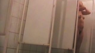 Shower spy cam amateur exposes tits and hairy cunt