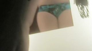 Full titted girl is staying on spy cam in sexy green panty