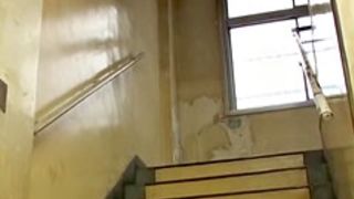 Nurse on the stairs tries to run away from sharking fan
