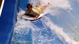 Sexy flowrider is demonstrating her downblouse in aqua park