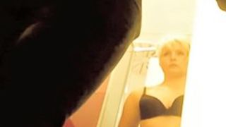 Blonde mature goes out of the bra in changing room