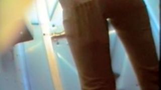 Beautiful peachy nub of the girl pissing on toilet