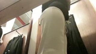 Babe in changing room trying on cloths and getting ass spied