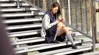 Asian schoolgirl on a break got skirt sharked while texting