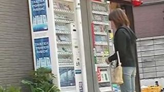 Vending machine Shuri sharking scene of beautiful Asian brunette