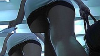 Fascinating bombshell with hot hairstyle in upskirt vid