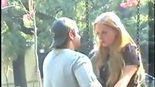 Blonde's kissing a guy on a public street