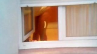 Guy made a window peep vid with a chick stripping
