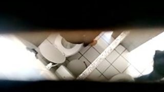 Chick is pissing, while a cam is filming