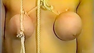 Slave girl gets her breasts tortured with ropes