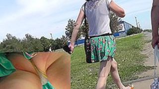 Pretty chick followed by a guy with upskirt camera