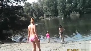 Sunny day at the nudist camp by the river