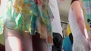Chick in colorful dress bus upskirt