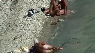 Two nudist couples spied at rocky beach