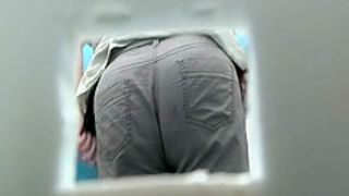Chubby ass takes a pee in portable toilet