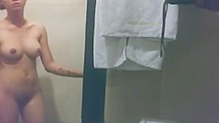 Asian woman secretly filmed in shower