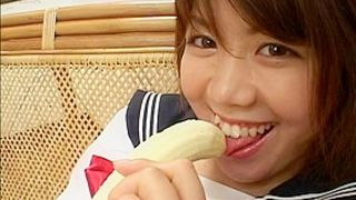 Cute and pretty teen babe playing with her banana and a hard cock and sticking