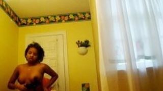 Ebony teen changing her bra - voyeur