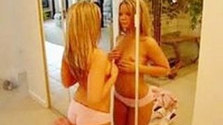 Blonde rubs her tits on the mirror