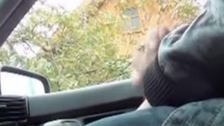 Man sitting in the car giving the view on his hard cock