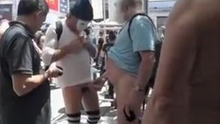 Old daddy strokes his thick dick in a crowd of naked people