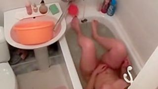 Woman spied in bathtub washing body