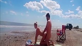 Incredibly sexy blonde nympho fucks total strangers at the beach
