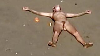 Dirty nudist girl on the beach