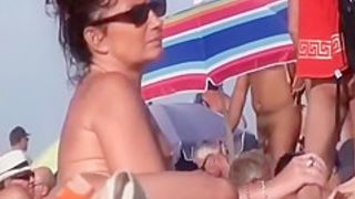 Horny mature nudists at a beach
