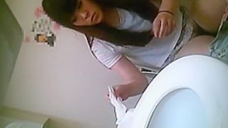 Asian women pissing in toilet