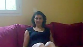 Milf makes a sextape with her man on the sofa