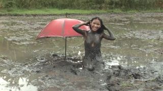 Petite Filipina Jane trashes her slutty little dress in a muddy rice paddy