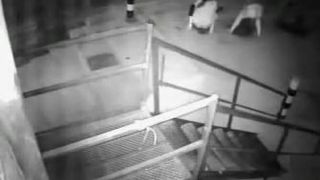 Two drunk girls get caught on security cam pissing really hard