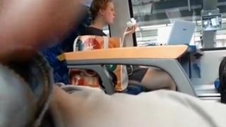 Guy plays with his dick in train