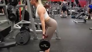 Brunette and blond fit chicks exercising